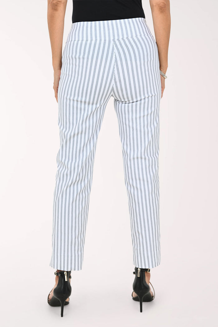 A model wearing light blue and white vertically striped cropped trousers, paired with a black top and black strappy high-heeled sandals, against a plain white studio background.