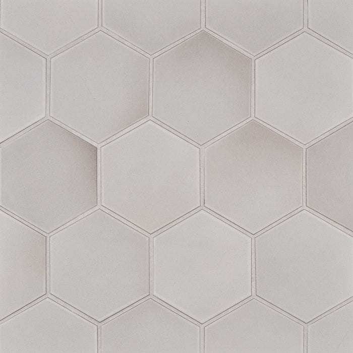 Caption: Classic Field 5" Hex in M144 Oat. Urban Putty grout by Custom Building Products.