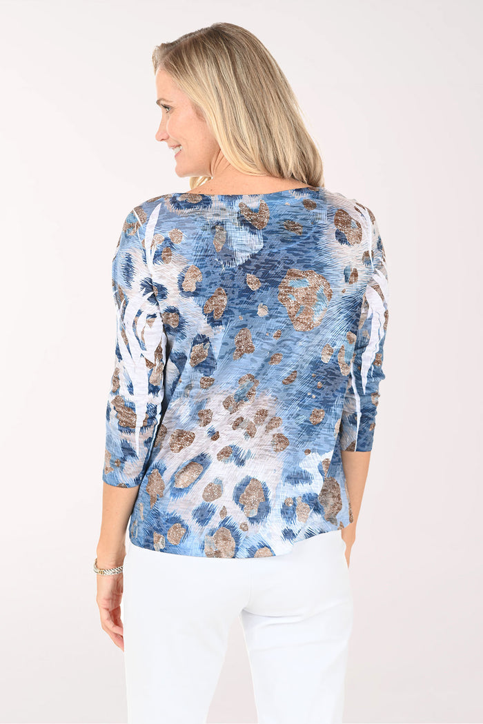 Woman wearing a blue floral blouse on a white background