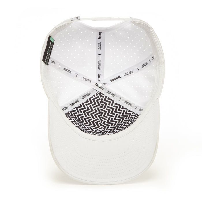 Inside view of the PULL OUT - Performance Golf Rope Hat - Snapback: white cap with black and white zigzag crown, perforated breathable material, sweat-resistant white band with repeated text, side tags. Shown on a plain white background.