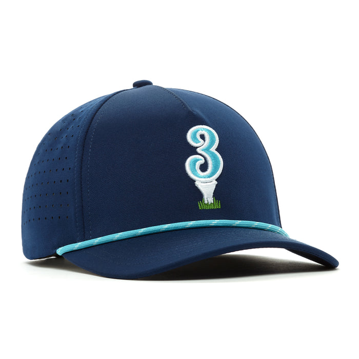The 3 Off The Tee Performance Golf Rope Hat is a navy blue snapback with a large white and teal number 3 on the front, golf tee and grass graphics, perforated side panels, performance material, and a blue rope above the curved brim.