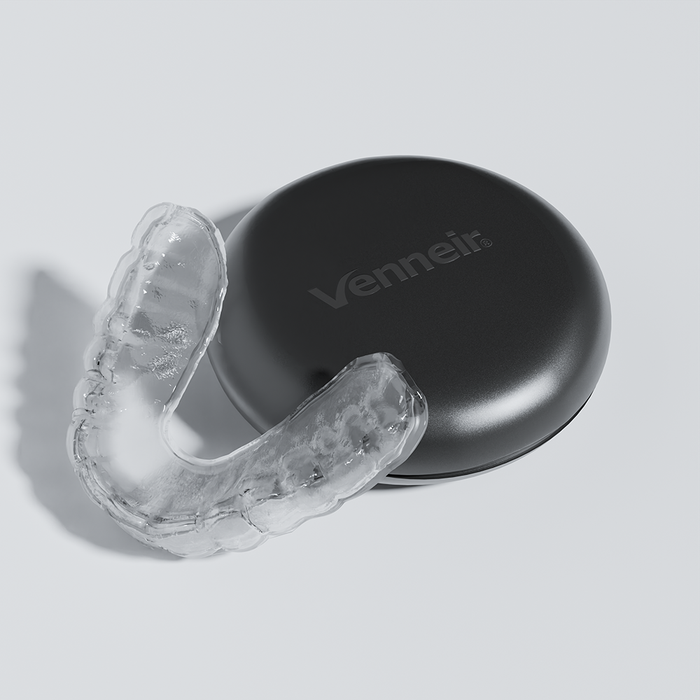 Custom night guard for lower teeth grinding with black protective storage case