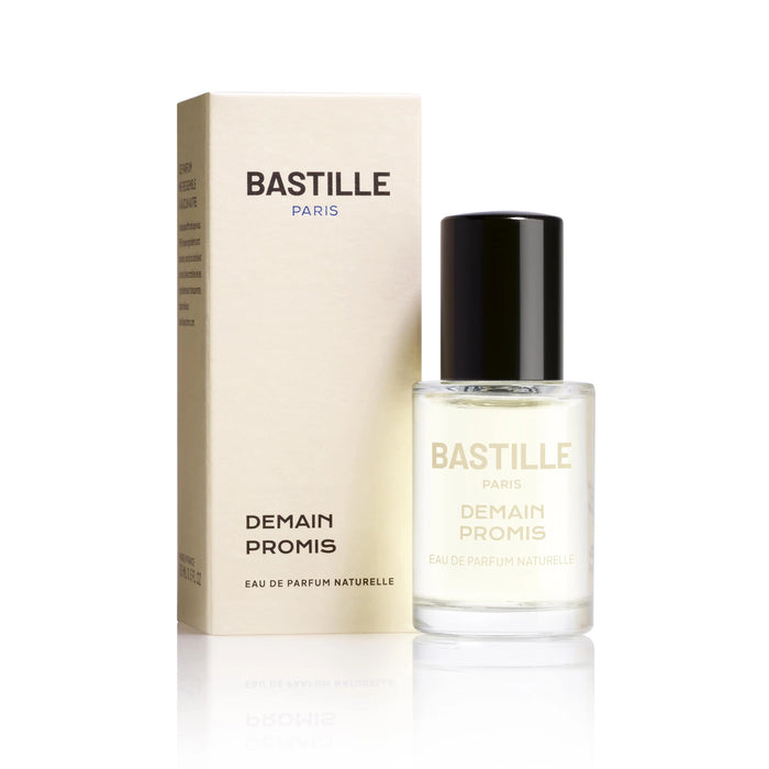 A bottle of 'Demain Promis EDP' by Bastille, placed next to its packaging box. The bottle is clear with a black cap, and the label has the brand name and product name printed on it.