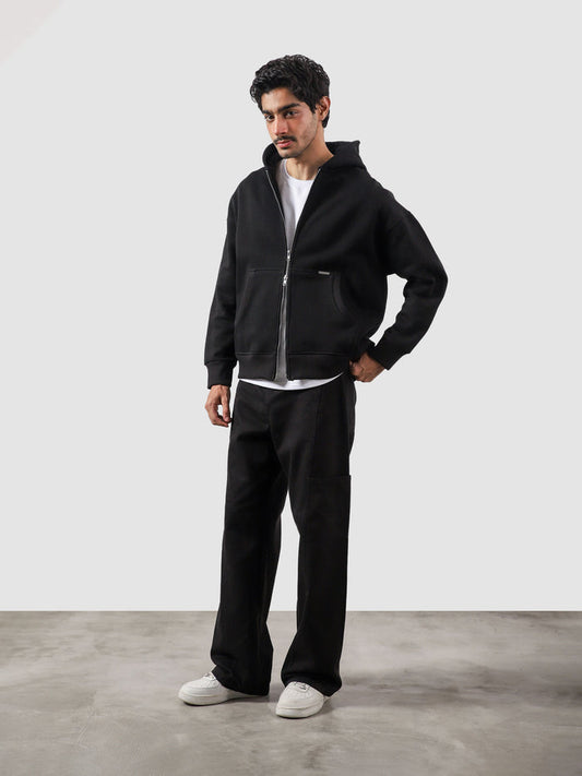 Black essential zipper hoodie male model side view full body Pakistan – GROOVY