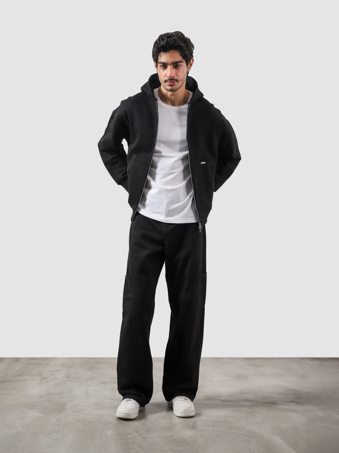 Black essential zipper hoodie male model back view relaxed fit Pakistan – GROOVY