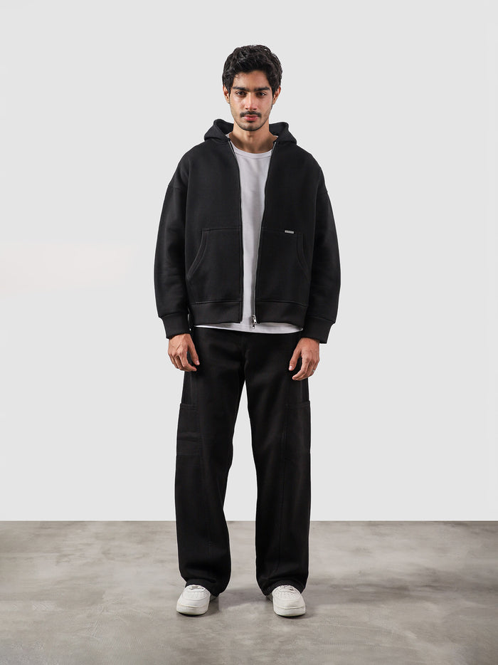 Black essential zipper hoodie male model full body front view Pakistan – GROOVY