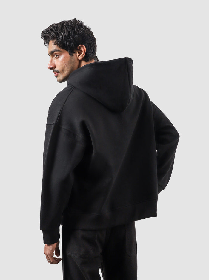 Black essential zipper hoodie female model back view relaxed fit Pakistan – GROOVY