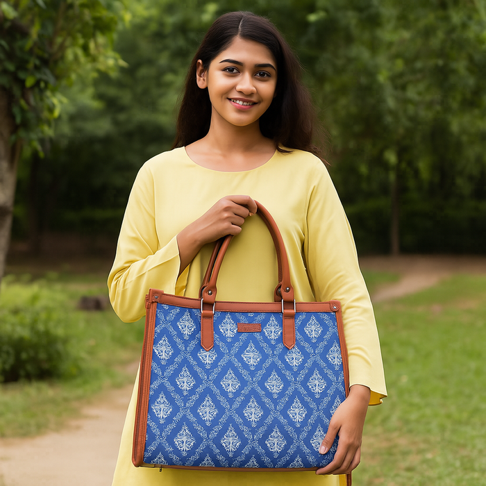 Handcrafted blue printed canvas top‑handle laptop tote bag with padded laptop compartment and shoulder strap for travel, work and everyday use-model image