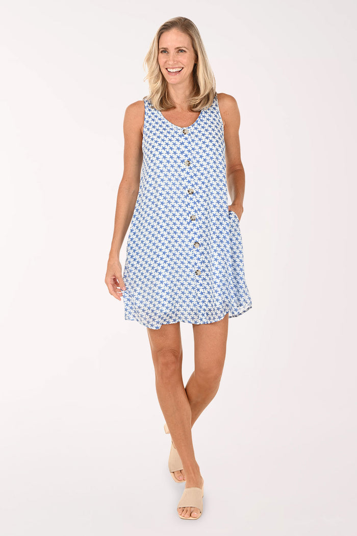 Woman wearing a blue patterned dress on a white background