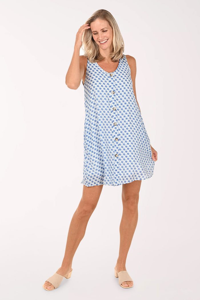 Woman wearing a blue patterned dress on a white background
