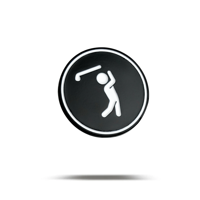 The Bogeyman - Ball Marker is a round black button with a white outline, featuring a simple white golf player icon mid-swing, floating above a faint shadow on a plain white background.