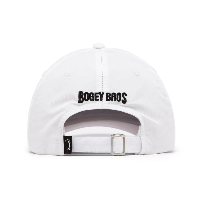 The Bogeyman White/Black Dad Hat is a white cap seen from the back, featuring "BOGEY BROS" embroidered in black above an adjustable strap with a silver buckle, a black tag with a white golf icon, and an interior sweatband for comfort.