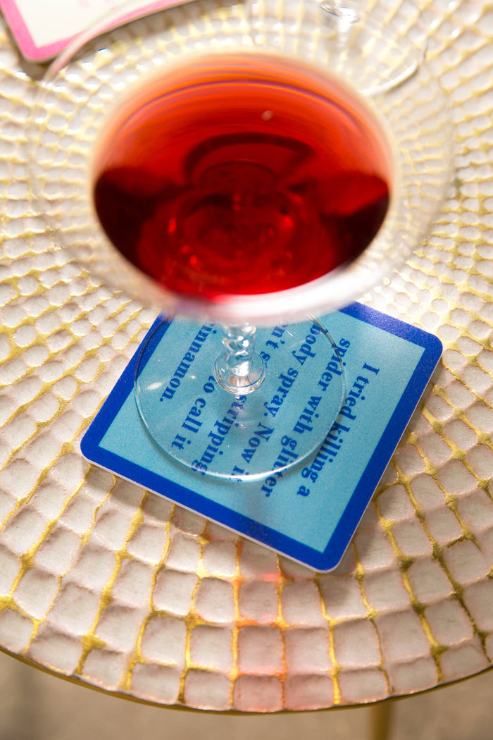 Wine glass over coaster with text I tried killing a spider...