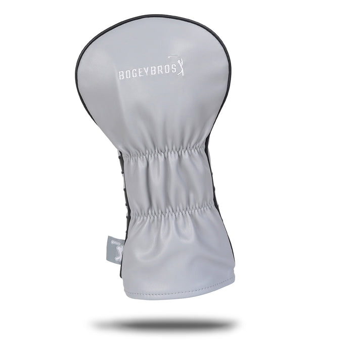The Curves Right - Driver Headcover features premium light gray PU leather, black side panels, gathered elastic center, and white embroidered BOGEYBROS text with a golfer icon. It stands upright on a plain white background with a soft shadow.