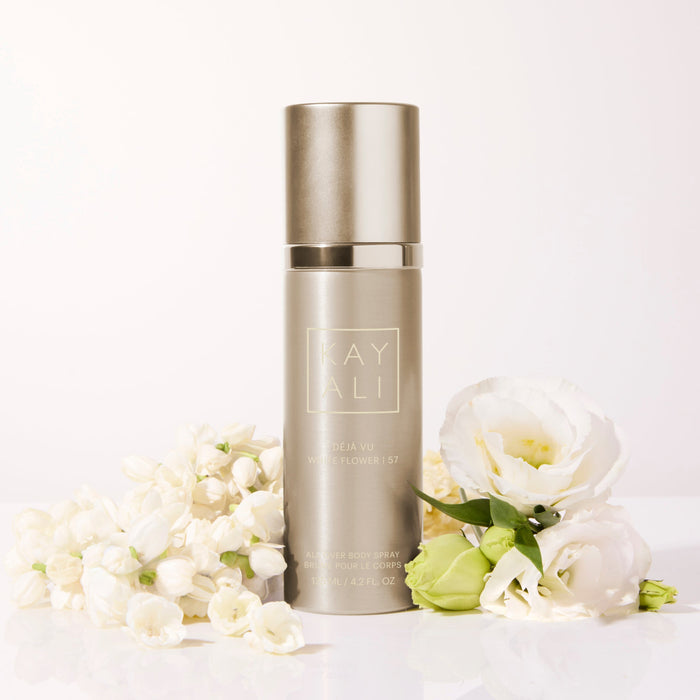 Fragrance bottle with flowers on a white background