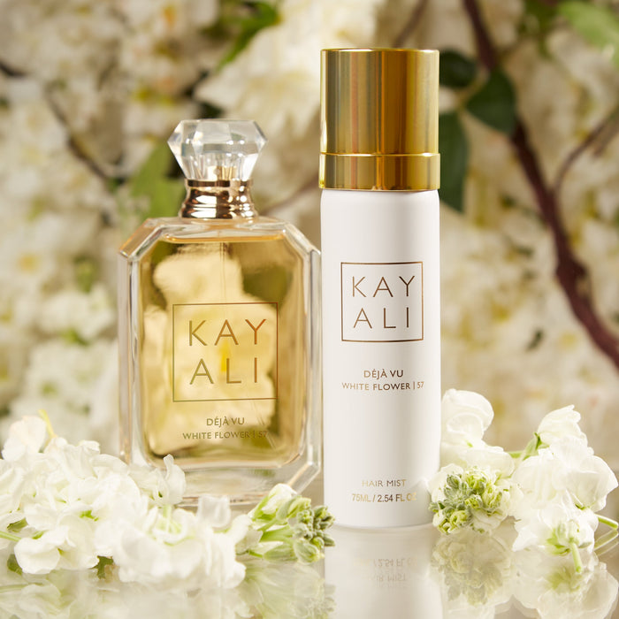 Two perfume bottles by KAYALI on a floral background