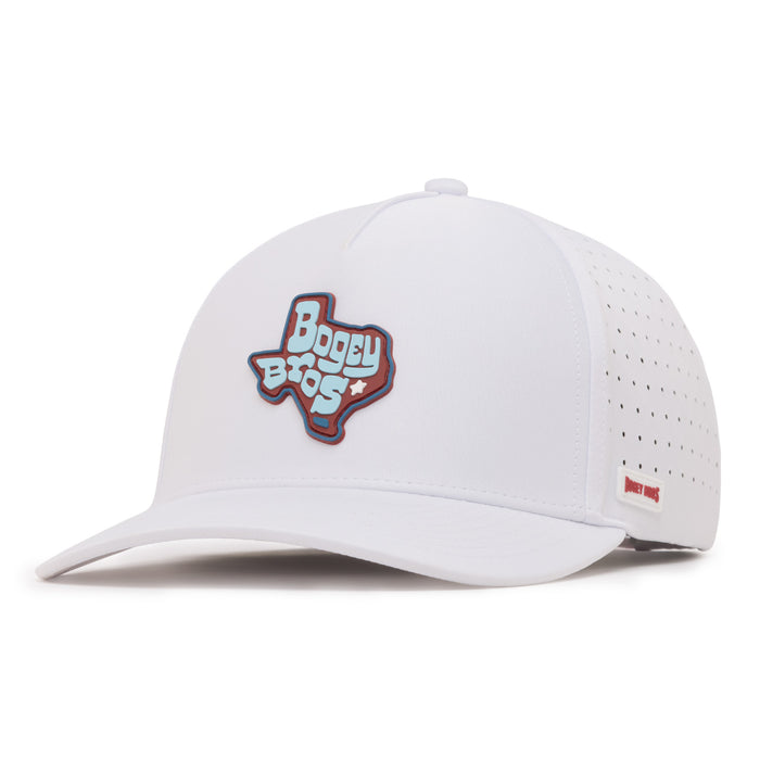 A white baseball cap with a perforated back panel, featuring a patch on the front in the shape of Texas with Bogey Bros written on it in bold lettering. Theres a small red tag on the side near the brim. The cap has a curved bill.