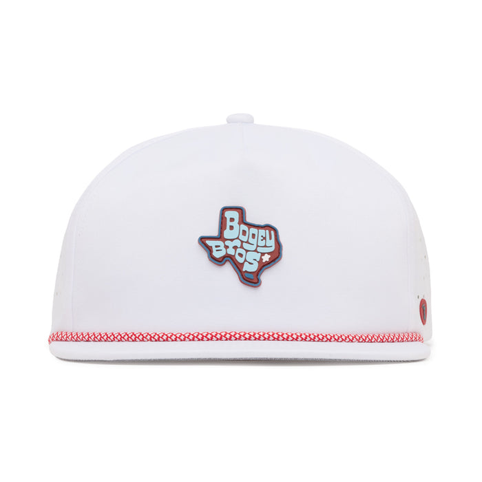 A white hat with red trim features a Texas-shaped patch in the center that reads “Bogey Bros” in stylized letters. The patch is blue with white and red accents. The hat is viewed from the front against a plain white background.