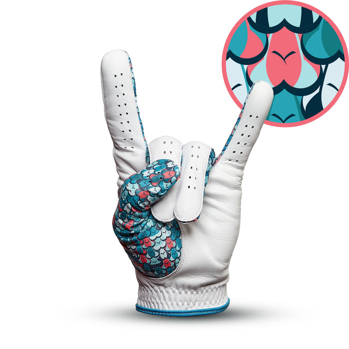 The Eyes Up Here - The 305 - Glove is a white Cabretta leather golf glove featuring a turquoise and pink fish-scale pattern on the palm, forming a rock on hand gesture; inset highlights the scale pattern in teal, white, and pink.