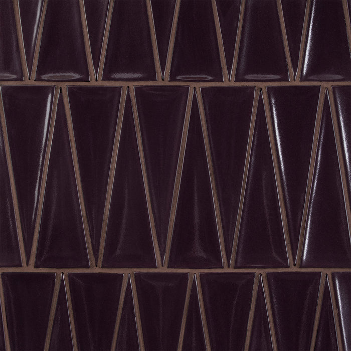 Caption: Dimensional Triangle in G127 Nightfall. Prism Sable Brown grout by Custom Building Products.