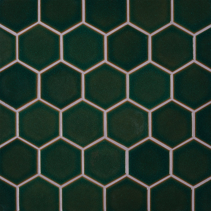 Caption: Classic Field 3.5" Hex in G129 Reef. Truffle grout by Custom Building Products.
