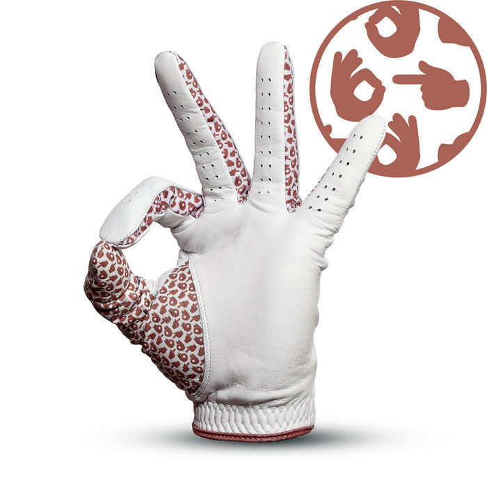 The Get In The Hole - Glove, a white golf glove with leopard-print inner fingers, makes an OK gesture to highlight its Precision Fit. A brown circular icon in the top right shows three hands making sign language gestures on a white background.