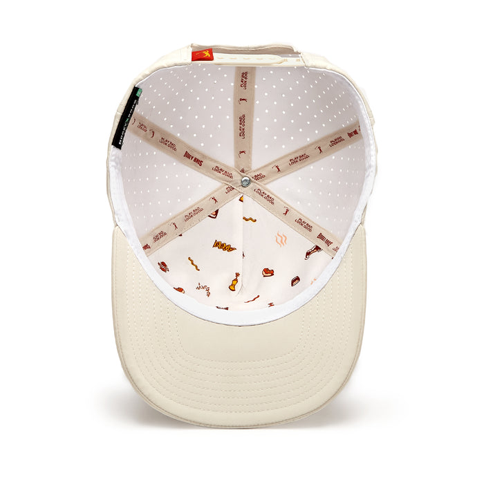 An overhead view of the Glizz Reaper - Performance Golf Hat - Snapback shows its off-white interior, featuring sweat stain resistant perforated white lining, icon details, and beige seam tape with brown logos.