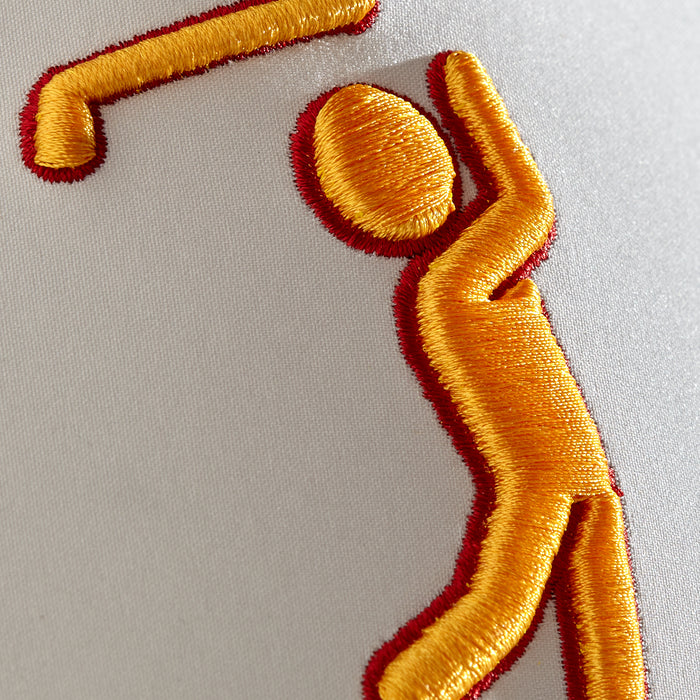 Close-up of the Glizz Reaper Performance Golf Hat's white snapback, featuring a yellow stick figure with red outline raising one arm and a separate yellow shape above it. Fine thread details and shadows enhance the embroidered design.