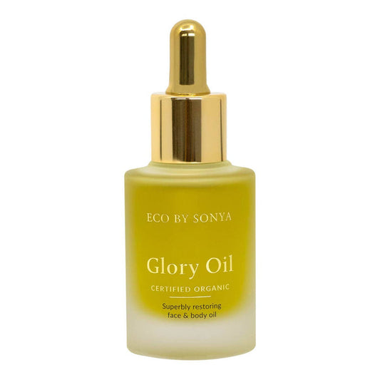 Bottle of Eco by Sonya Glory Oil with gold cap on a white background.