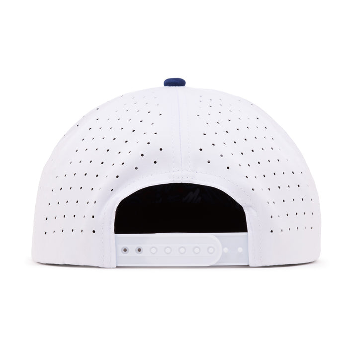 The image shows the back view of a white baseball cap with small ventilation holes. The cap features an adjustable plastic snapback strap, and a small blue button is visible at the top center. The inside of the cap appears dark.