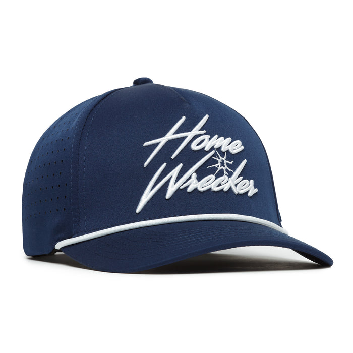 The Home Wrecker Performance Golf Rope Hat is a navy blue snapback featuring white "Home Wrecker" embroidery with a graphic tree, ventilation holes, and a white accent line above the curved brim. Made from sweat stain resistant material.