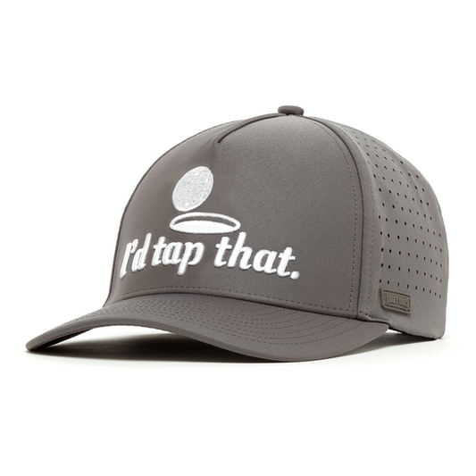 The "I’d Tap That - Performance Golf Hat - Snapback" is a gray cap with side ventilation, crafted from sweat stain resistant performance material. It features a white embroidered golf ball, bold "Id tap that." text, and a metallic logo on the brim.