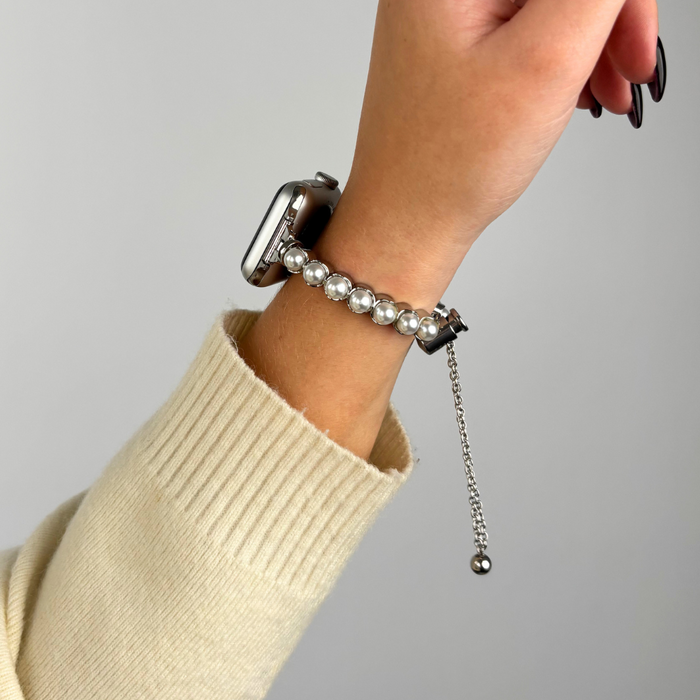Silver Isla Pearl Apple Watch strap by Coconut Lane on a wrist, shown against a plain background.