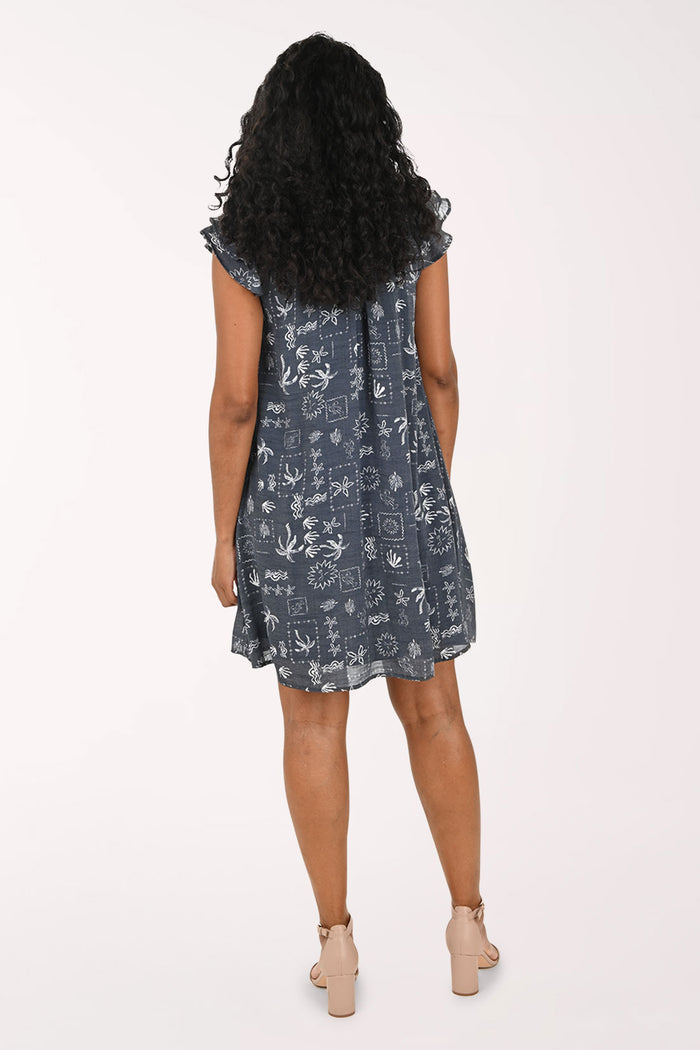 Woman wearing a floral dress on a white background