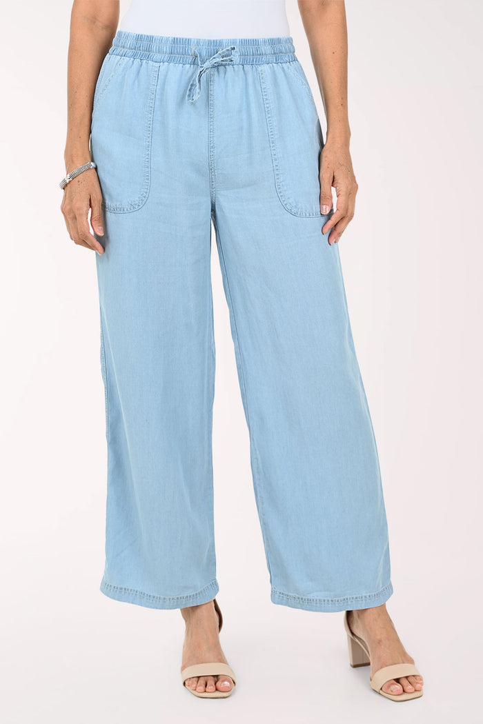 Light blue wide-leg cropped pants with an elastic drawstring waist and large front patch pockets, shown on a model against a plain light background.