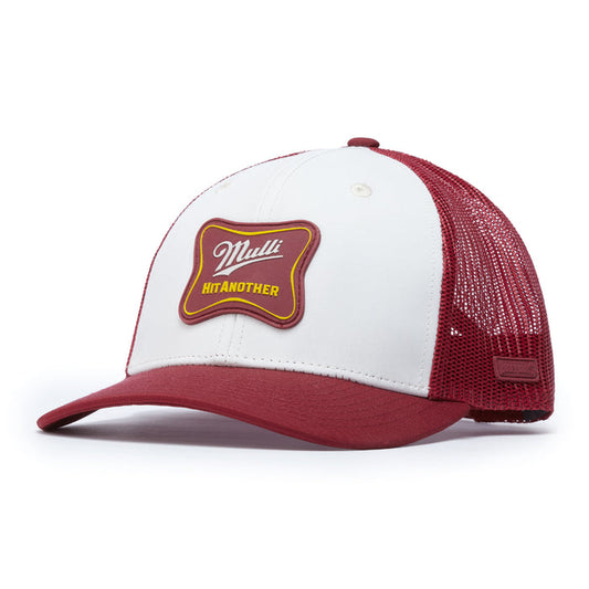 The Mulli Hit Another Mesh Trucker Hat - Snapback features a white front with a red and yellow patch reading "Mulli HIT ANOTHER" and solid red bill, sides, and breathable mesh back. Curved brim with adjustable snap closure.