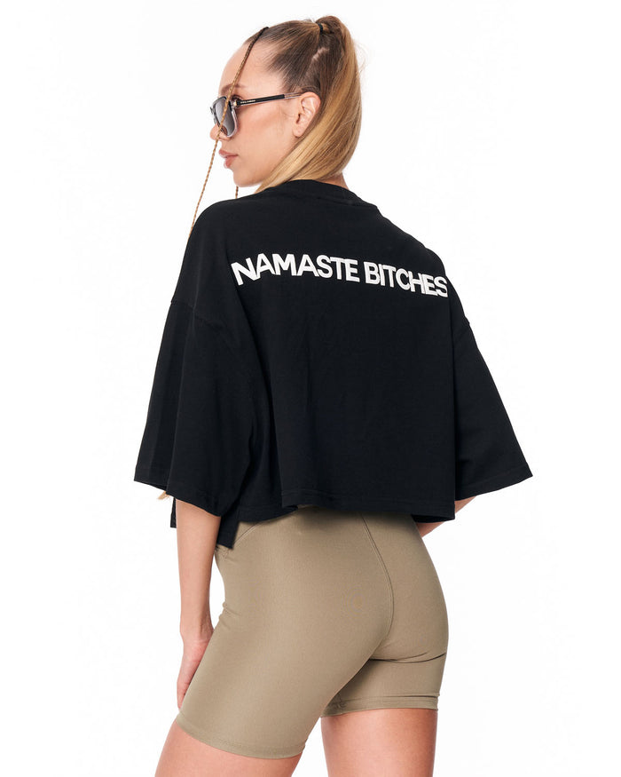 Black cropped T-shirt with dropped shoulders and wide sleeves