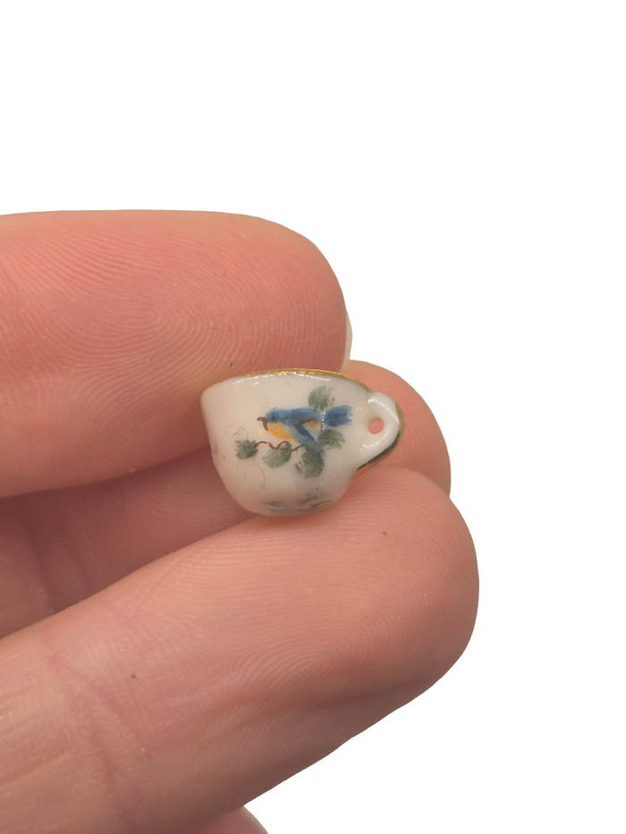 Nancy Duden – Porcelain Cup & Saucer with Handpainted Bird Design