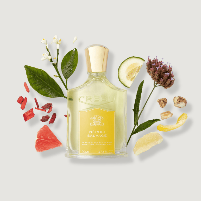 Néroli Sauvage 100ml with Citrus, Neroli Blossom and Spice Ingredients Flat Lay | Creed Fragrances