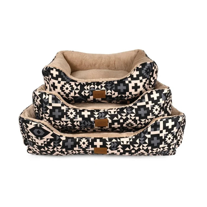 Set of three patterned pet beds on a white background