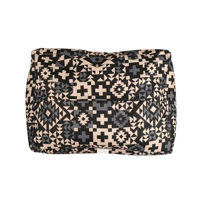 Folded blanket with geometric pattern on a white background