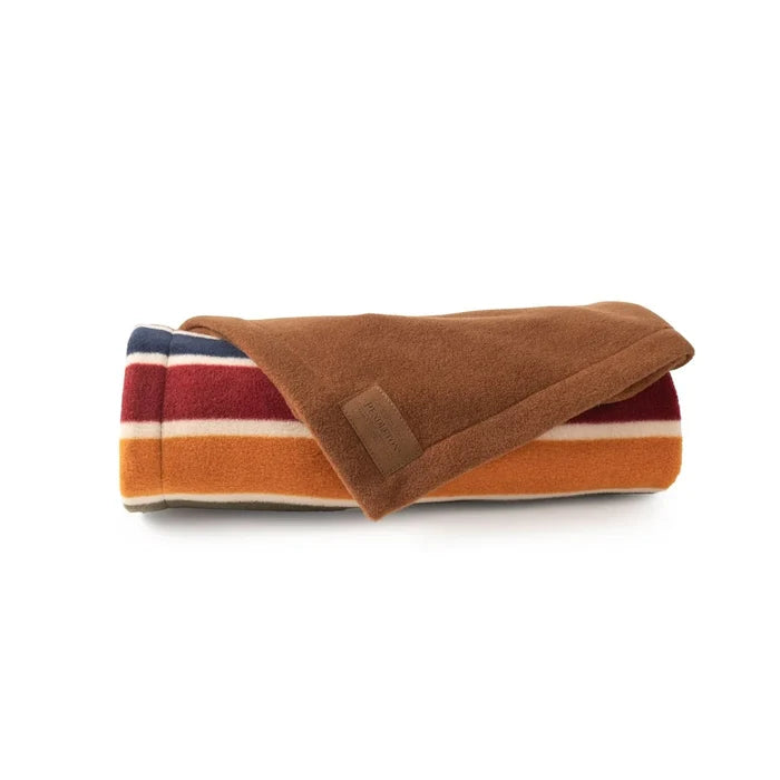 Folded blanket with striped pattern on a white background