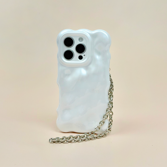 Silver chain phone strap from Coconut Lane on a white wavy case, set against a light beige background.