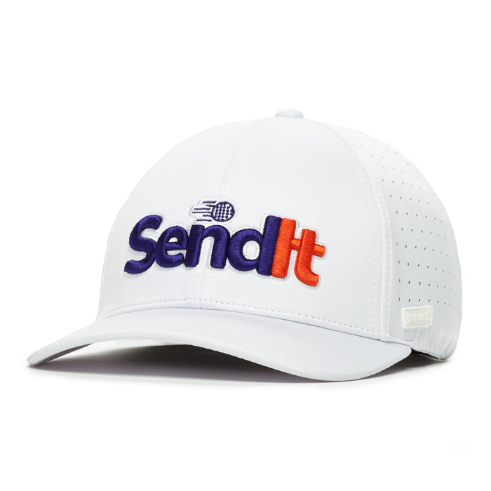 The Send It - Performance Golf Hat - Stretch Fit is a white cap with perforated sides, a stretchable band, and curved brim. "Send It" appears in bold blue and red embroidery with a stylized motion graphic before the phrase on the front.