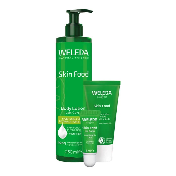 Weleda Skin Food body lotion, skin food face and body cream and skin food lip balm on a white background