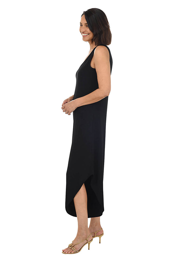 Woman wearing a black sleeveless dress on a white background