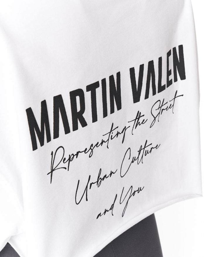 White t-shirt featuring a black graphic print with the text 'MARTIN VALEN' in a bold sans-serif font, followed by 'Representing the Street Urban Culture and You' in a script font.