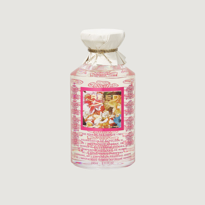 Creed Spring Flower 240ml glass flacon with pink floral label and white leather cap - Front View | Creed Fragrances