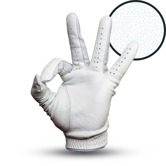 The Stealth Mode - Light - Glove, in white cabretta leather, forms an OK sign on a plain white background. A large circular inset near the fingers shows a subtle, abstract pattern of pale lines and shapes.