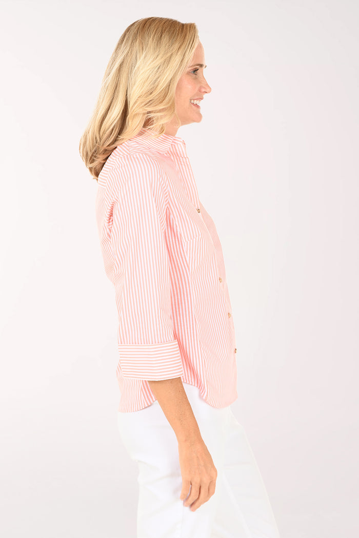 Woman wearing a pink striped shirt on a white background